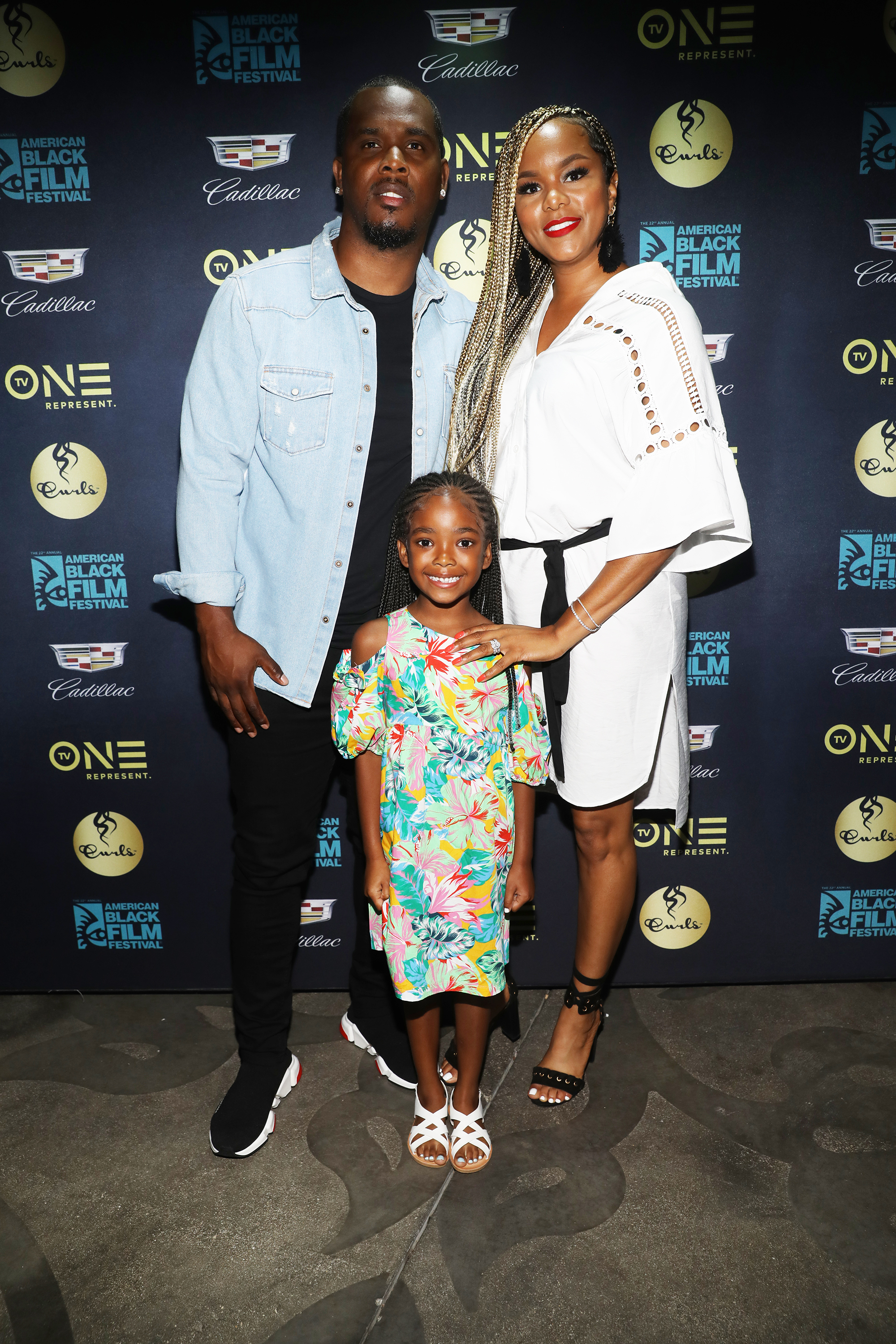 LeToya Luckett et Tommicus Walker avec leur fille Madison.