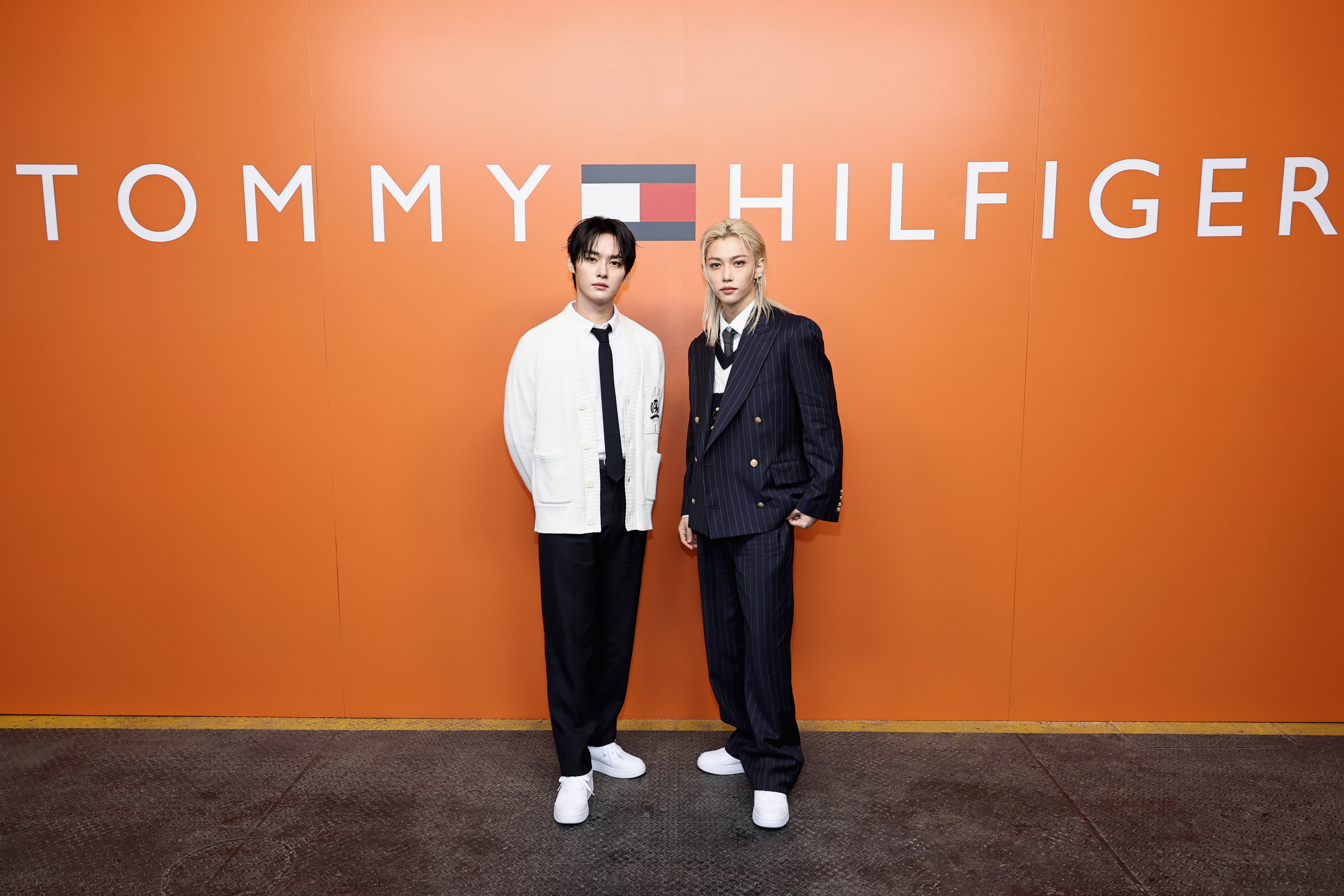 Lee Know and Felix of Stray Kids attend the Tommy Hilfiger fashion show during New York Fashion Week.